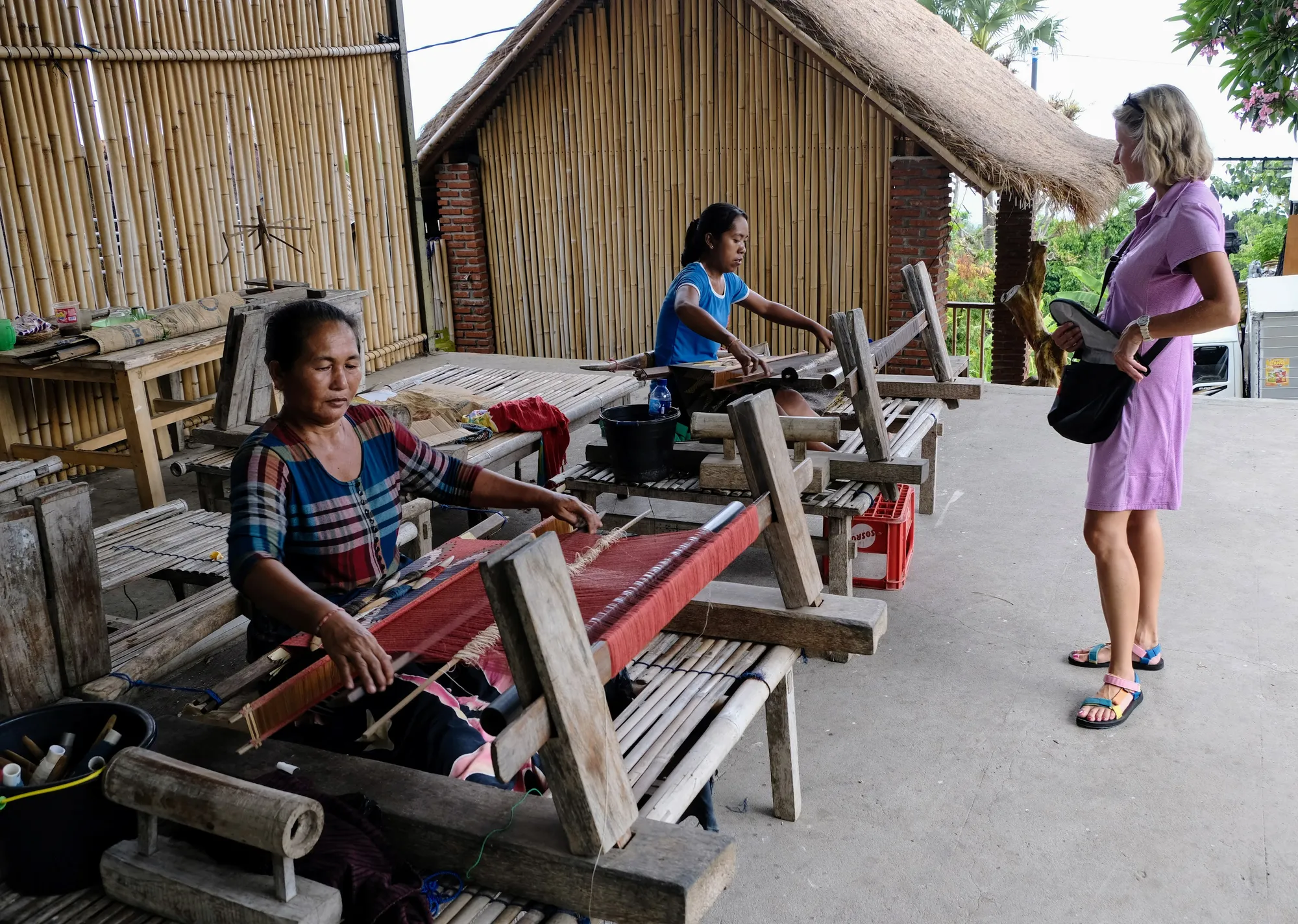 Women working on backstrap looms