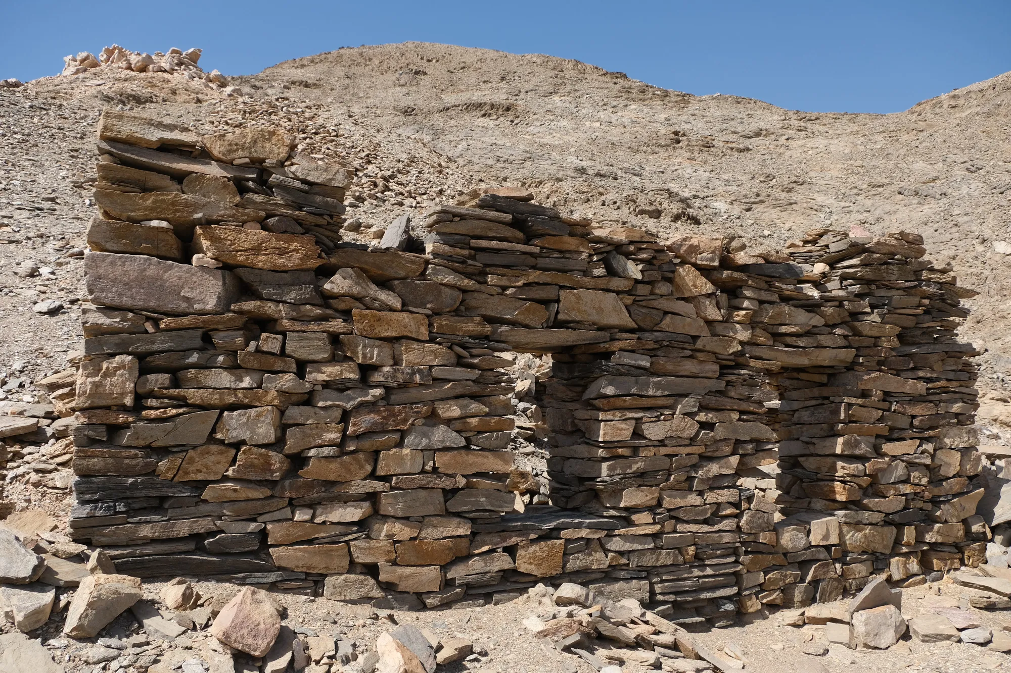 From left to right: Mustafa showing us emeralds he found on the wadi's floor, Sikait miners' living quarters and workshops