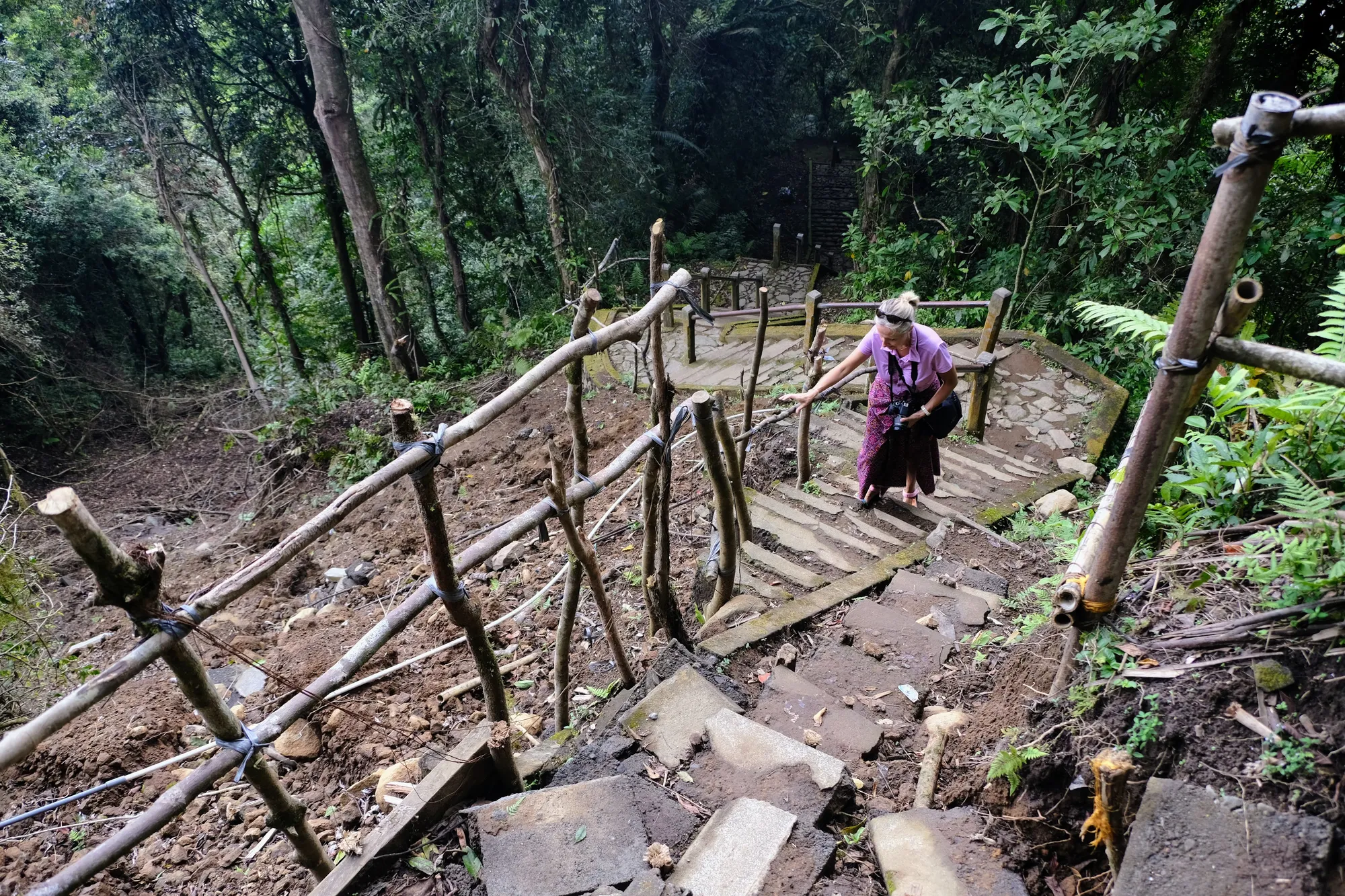 Climbing the stairs to the temples, local families who come to worship at the temple complex